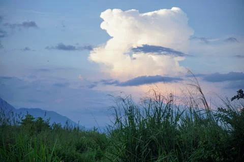 Evening sky view with dramatic large clouds illuminated by natural light Stock Photos