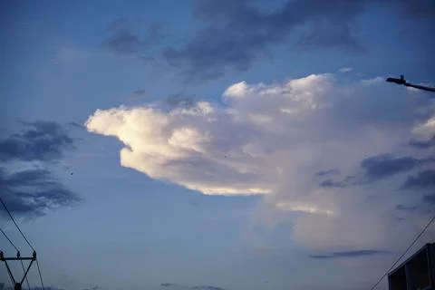 Evening sky view with dramatic large clouds illuminated by natural light Stock Photos
