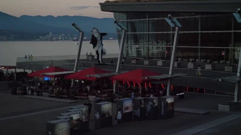 Evening slow motion float plane lands at Vancouver waterfront Stock Footage 77936121