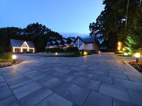 Evening square with burning lights Stock Photos