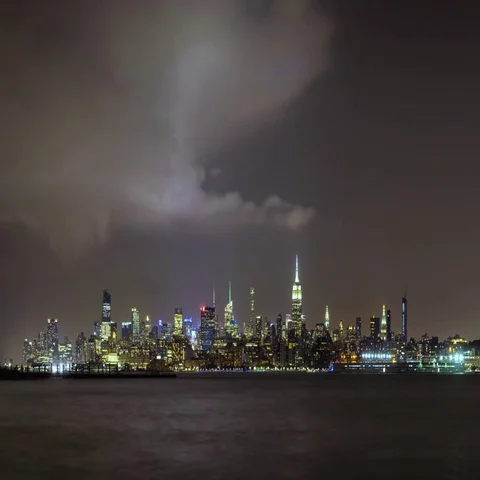 Evening storm and lightning in New York City over Midtown Manhattan skyscrapers Stock Footage 69457933