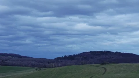 Evening storm clouds move over hills and forests 스톡 동영상 271185729
