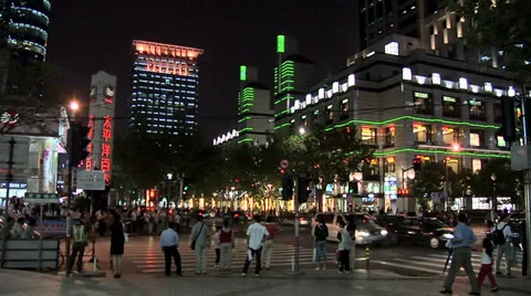Evening Street Scene at the busy Intersection of Huaihai Zhonglu and Huangpi Stock Footage 38600762