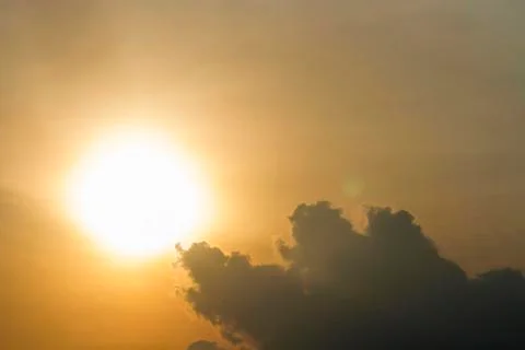 Evening sun with clouds on the sun Stock Photos