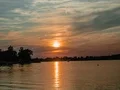 Evening sun descending behind the clouds - time lapse 4k or 4k+ Resolution
