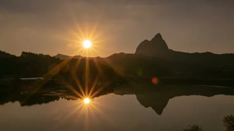 The evening sun goes down beyond Maisan Provincial Park. Zoom in Video stock 145703502