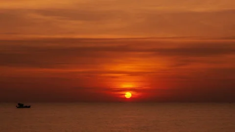 The Evening Sun at The Golden Hour Sets Over The Calm Surface of The Sea. Sunset Stock Footage 273696574