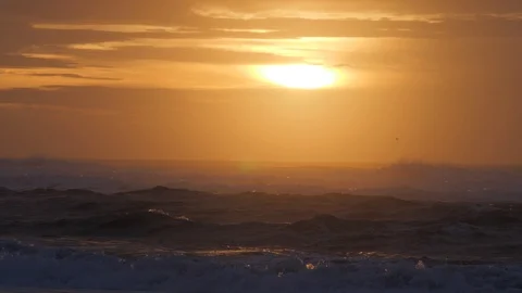 Evening sun over several ocean waves Stock Footage 103069783