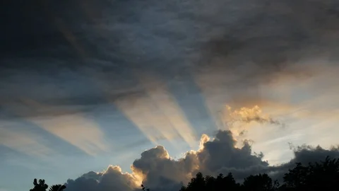 Evening sun rays through clouds and dark smoke cloud from fire covering sky 3of3 Stock Footage 101438663