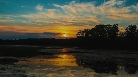 Evening Sun Is Slowly Setting Behind The Trees - Timelapse 動画素材 157898425