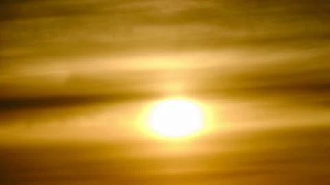 Evening sun through overcast clouds on a hot misty sky, timelapse. Sunset in a h Stock Footage 178978141
