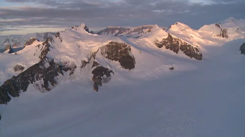 Evening sunlight on the Antarctic Peninsula mountains. Aerial Stock Footage 34312797