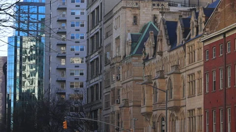 Evening sunlight illuminates the rows of buildings in East Village NYC. Video stock 150863349