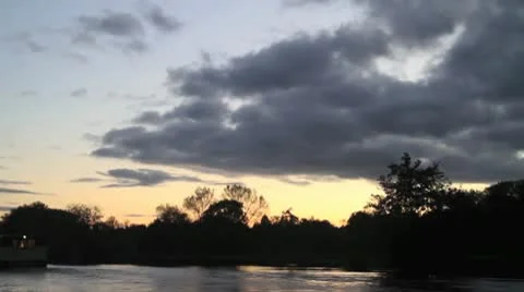 Evening sunlight - pan along river Stock Footage 10591580
