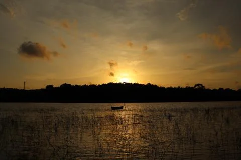 The evening sunlight is reflected in the river below Stock Photos