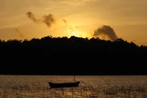 The evening sunlight is reflected in the river below Stock Photos