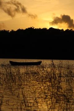 The evening sunlight is reflected in the river below Stock Photos