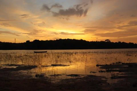 The evening sunlight is reflected in the river below Stock Photos
