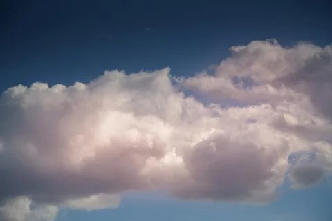 Evening sunlight on white clouds in the sky, sky landscape with evening light Stock Photos