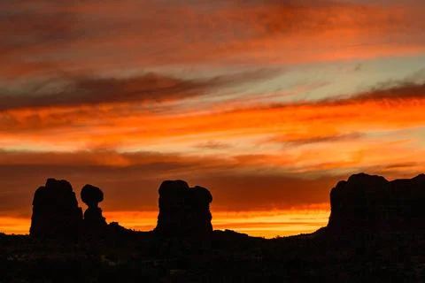 Evening sunset against the backdrop of the mountain landscape, and the red .. Stock Photos