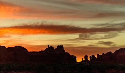 Evening sunset against the backdrop of the mountain landscape, and the red .. Stock Photos
