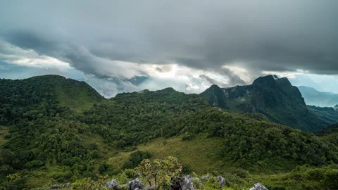 Evening sunset and moving clouds from the top of Doi Luang Chiang Dao Stock Footage 258457510