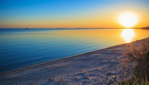 Evening sunset on the bay Stock Photos