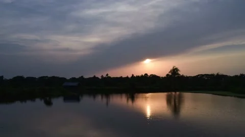 Evening Sunset in Blue Sky and Puffy Clouds Over the Lake Full HD Timelapse Stock Footage 133000125