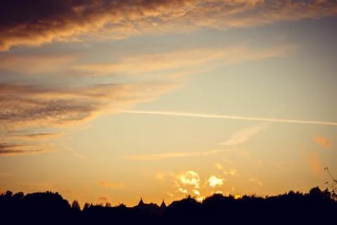 Evening sunset with clouds on the background of the shadows of buildings Fotos de archivo