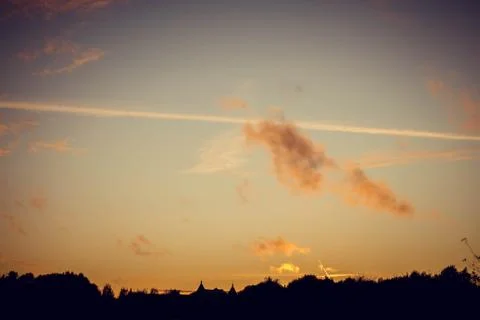 Evening sunset with clouds on the background of the shadows of buildings Fotos de archivo