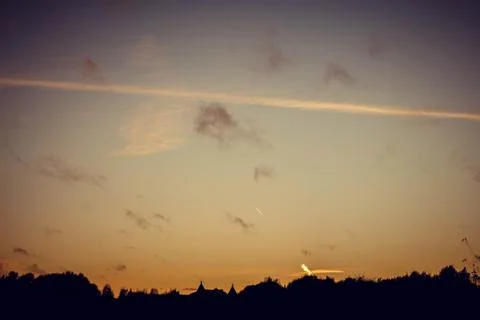 Evening sunset with clouds on the background of the shadows of buildings 写真素材