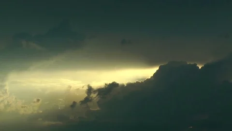 Evening. Sunset. The clouds floating in the sky constantly close the sun. 動画素材 70647490