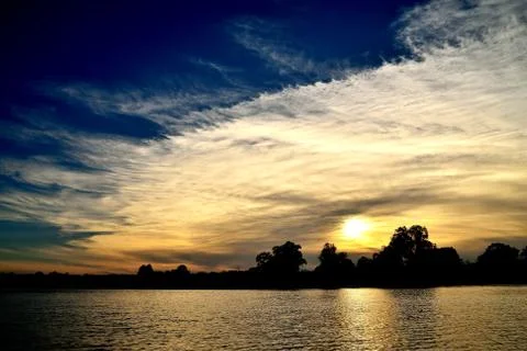 Evening, sunset, clouds, river, sky Stock Photos