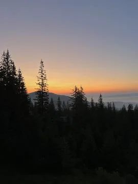 Evening sunset of endless mountains Stock Photos