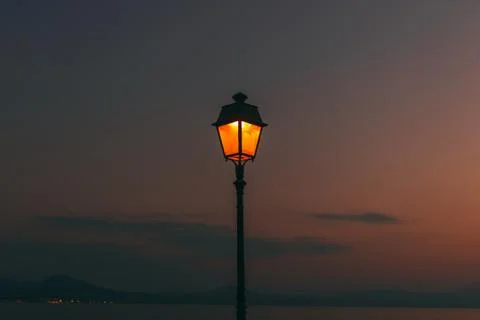 Evening sunset at the Greece. Lighting inside Lantern shining. Background pic Stock Photos