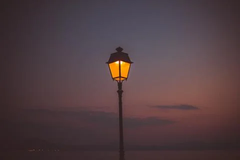 Evening sunset at the Greece. Lighting inside Lantern shining. Background pic Stock Photos