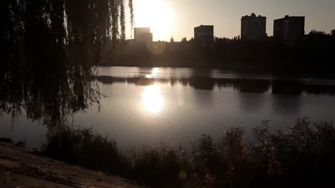 Evening sunset overlooking the city by the river Stock Footage 97805071
