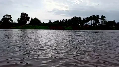 Evening sunset reflection on krishna river water at Sangli, Maharashtra, India. Stock Footage 138322304