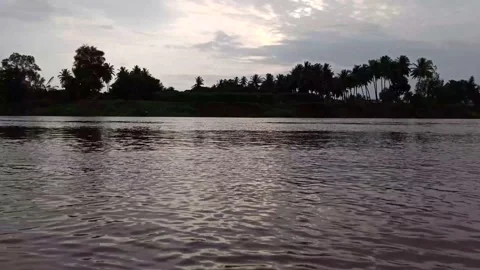 Evening sunset reflection on krishna river water at Sangli, Maharashtra. Stock Footage 138322683