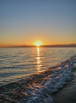 Evening sunset at the sea Stock Photos