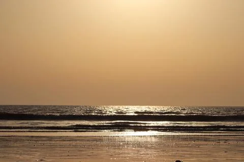 Evening Sunset View On The Beach With Ocean Waves Stock Photos