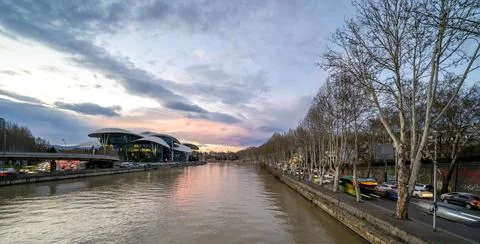 Evening sunset view of Mtkvari river and cityscape of Tbilisi, the capital .. Stock Photos