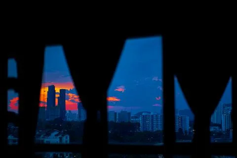 Evening sunset view from the window of the apartment on a multi-lane highway  Stock Photos