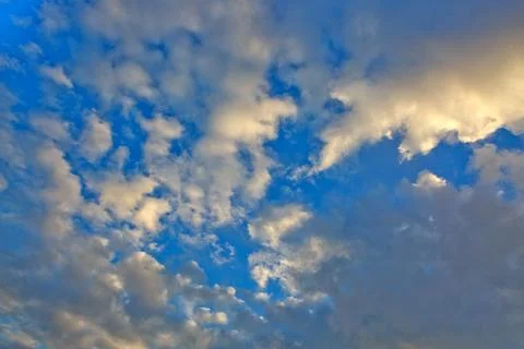 Evening sunshine background with clouds dramatic sky. Stock Photos