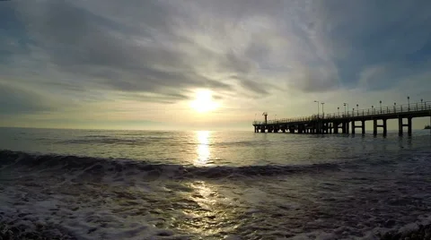 Evening surf in Black Sea at sunset and the pier in Sochi 스톡 동영상 48993824