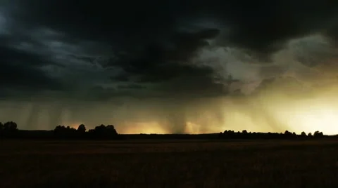 Evening thunder over a farm field. Stock Footage 51657038