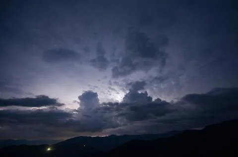 Evening thunderstorm with lightning in the mountains. Dramatic clouds durin.. Fotos de archivo