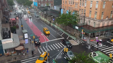 An evening thunderstorm wets cityscape in the East Village, Manhattan. Stockbeeldmateriaal 345095259