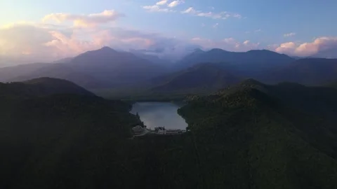 Evening time drone flight to Kvareli lake with view on it and mountains after it Stock Footage 255248134