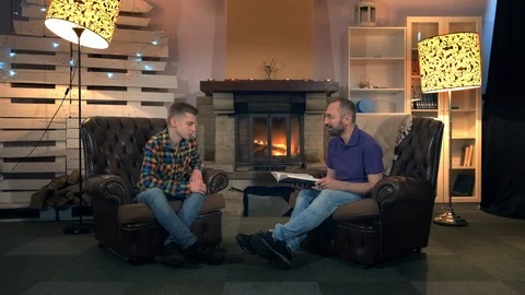 Evening time with father: son discussing something with his dad Stock Footage 113882689